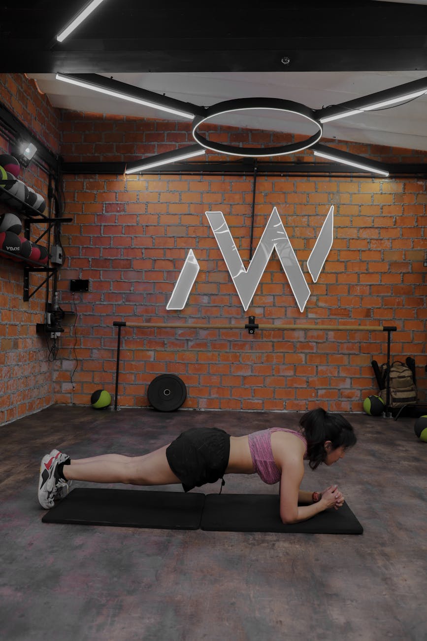 Woman in a plank position focusing on core